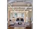 Bright living room with hardwood floors, coffered ceiling and view into dining area at 1307 Mayfair Rd, Raleigh, NC 27608