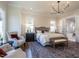 Main bedroom with sitting area and bathroom access at 1307 Mayfair Rd, Raleigh, NC 27608