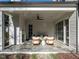 Inviting outdoor living area with a fireplace and comfortable seating for relaxing or entertaining guests at 1307 Mayfair Rd, Raleigh, NC 27608