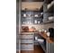 Organized pantry with custom shelving, lots of storage space, and good task lighting at 1307 Mayfair Rd, Raleigh, NC 27608