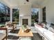 Spacious patio with seating, a fireplace, and a wooden coffee table at 1307 Mayfair Rd, Raleigh, NC 27608