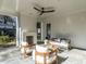 Covered patio with comfortable seating and a fireplace at 1307 Mayfair Rd, Raleigh, NC 27608