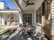 Covered patio featuring an outdoor dining table, chairs, and a view of the beautifully landscaped backyard at 1307 Mayfair Rd, Raleigh, NC 27608