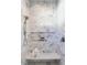Walk-in shower with marble tile and built-in shelf at 1307 Mayfair Rd, Raleigh, NC 27608