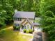 Aerial view of a two-story house with a driveway at 1554 Middle Ridge Dr, Willow Springs, NC 27592