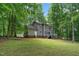 House exterior with deck and wooded backyard at 1554 Middle Ridge Dr, Willow Springs, NC 27592