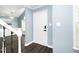 Bright entryway with hardwood floors and white door at 1554 Middle Ridge Dr, Willow Springs, NC 27592