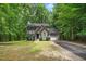Two-story house with attached garage and landscaping at 1554 Middle Ridge Dr, Willow Springs, NC 27592