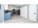 Updated kitchen with blue cabinets and quartz countertops at 1554 Middle Ridge Dr, Willow Springs, NC 27592