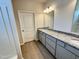 Bathroom featuring a double granite vanity with new cabinets and tile floors at 162 Vega Loop, Sanford, NC 27330