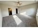 Spacious bedroom with neutral walls, ceiling fan, carpet flooring and ensuite bathroom at 162 Vega Loop, Sanford, NC 27330