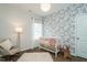 Charming Bedroom with floral wallpaper, soft rug, and adorable decor at 162 Vega Loop, Sanford, NC 27330