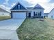 Charming single-Gathering home features a modern facade with a two-car garage and well-maintained lawn at 162 Vega Loop, Sanford, NC 27330
