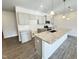 Modern kitchen with a granite island, stainless steel appliances, and plenty of cabinet space for all your culinary needs at 162 Vega Loop, Sanford, NC 27330
