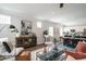 Bright living room with stylish decor, wood floors, and an open concept design at 162 Vega Loop, Sanford, NC 27330