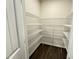 Walk-in pantry with wire shelving, and open space for storing food items, and kitchen essentials, making organization easy at 162 Vega Loop, Sanford, NC 27330
