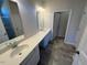 Bright bathroom featuring double sinks, a spacious counter, and modern fixtures at 17 E Victory View Ter, Smithfield, NC 27577