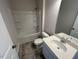 Bathroom featuring a tub/shower combo, vanity, and neutral finishes at 17 E Victory View Ter, Smithfield, NC 27577