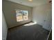 Bedroom with natural light from the window and neutral carpet at 17 E Victory View Ter, Smithfield, NC 27577