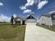 Charming single-story home with gray siding, a two-car garage, and a well-manicured lawn at 17 E Victory View Ter, Smithfield, NC 27577