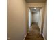 Hallway showcasing wood-look flooring leading to other rooms at 17 E Victory View Ter, Smithfield, NC 27577