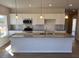 Open kitchen with an island, stainless steel appliances, and pendant lighting at 17 E Victory View Ter, Smithfield, NC 27577