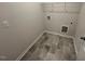 Efficient laundry room featuring tile flooring and convenient hookups for appliances at 17 E Victory View Ter, Smithfield, NC 27577