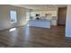 Spacious living room showcasing an open concept and wood flooring that extends into the modern kitchen at 17 E Victory View Ter, Smithfield, NC 27577