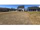 New construction two-story home with a spacious ungraded backyard lawn at 2006 Anna Lilley Dr # 72, Fuquay Varina, NC 27526