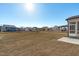 Expansive backyard with lush, green grass and charming views of neighboring homes on a sunny day at 2006 Anna Lilley Dr # 72, Fuquay Varina, NC 27526