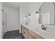 Bright bathroom with a double sink vanity, modern fixtures, and stylish arched mirrors at 2006 Anna Lilley Dr # 72, Fuquay Varina, NC 27526