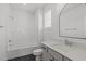 Bathroom featuring modern white vanity, framed mirror and bathtub-shower combo at 2006 Anna Lilley Dr # 72, Fuquay Varina, NC 27526