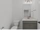 Powder room features a gray vanity, quartz countertop, modern faucet, and neutral walls at 2006 Anna Lilley Dr # 72, Fuquay Varina, NC 27526