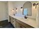 Modern bathroom boasts dual vanities with black fixtures and round mirrors adding elegance at 2006 Anna Lilley Dr # 72, Fuquay Varina, NC 27526