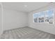 Bedroom with a large window and neutral carpet at 2006 Anna Lilley Dr # 72, Fuquay Varina, NC 27526