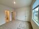 Spacious carpeted bedroom with white trim and several doors and a bright window at 2006 Anna Lilley Dr # 72, Fuquay Varina, NC 27526