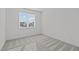 Bright bedroom with a large window and neutral carpet at 2006 Anna Lilley Dr # 72, Fuquay Varina, NC 27526