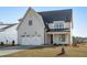 Newly constructed two-story home with a two-car garage and charming curb appeal at 2006 Anna Lilley Dr # 72, Fuquay Varina, NC 27526