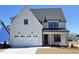 Charming two-story home with white siding, a garage, and a well-manicured lawn at 2006 Anna Lilley Dr # 72, Fuquay Varina, NC 27526