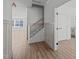 Open foyer with hardwood floors and a view of the staircase and living areas at 2006 Anna Lilley Dr # 72, Fuquay Varina, NC 27526