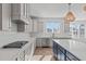 Kitchen featuring white countertops, stainless steel appliances, island and gas cooktop at 2006 Anna Lilley Dr # 72, Fuquay Varina, NC 27526