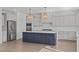 Spacious kitchen featuring a blue island, white countertops, and stainless steel appliances at 2006 Anna Lilley Dr # 72, Fuquay Varina, NC 27526