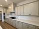 An updated kitchen with light gray cabinetry, stainless appliances, and a subway tile backsplash at 2006 Anna Lilley Dr # 72, Fuquay Varina, NC 27526