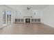 Spacious living room features a fireplace, built-in shelves, and sliding glass doors to outdoor space at 2006 Anna Lilley Dr # 72, Fuquay Varina, NC 27526