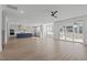 Open floorplan showcasing the living room, kitchen with island, and access to outdoor living space at 2006 Anna Lilley Dr # 72, Fuquay Varina, NC 27526