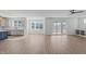 Large living area with wood-look flooring, expansive windows, and sliding glass doors to outdoor space at 2006 Anna Lilley Dr # 72, Fuquay Varina, NC 27526