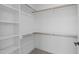 Spacious walk-in closet with wood shelving and carpet floors at 2006 Anna Lilley Dr # 72, Fuquay Varina, NC 27526