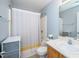 Clean bathroom with shower/tub combo and wood vanity at 2019 Tennessee Rd, Durham, NC 27704