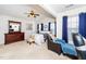 Bright bedroom featuring a ceiling fan and comfortable seating area at 2019 Tennessee Rd, Durham, NC 27704