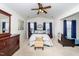 Spacious bedroom with ceiling fan, large windows, and ample natural light at 2019 Tennessee Rd, Durham, NC 27704